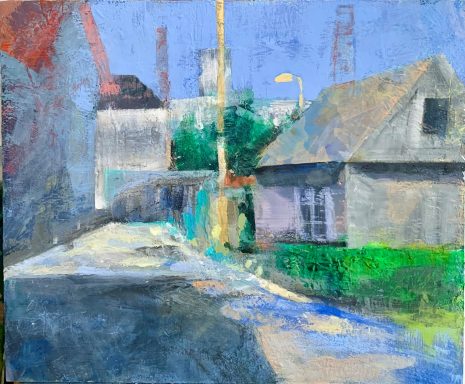 Usti nad Olici Blick auf eine Straßenansicht mit kleinen Häusern und grünen Büschen vor blauem Himmel.